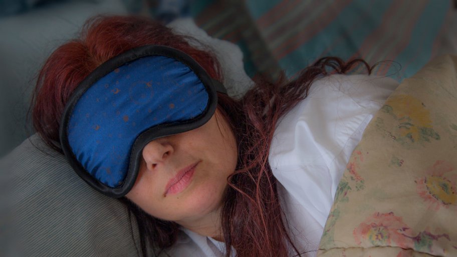 woman wearing sleep mask